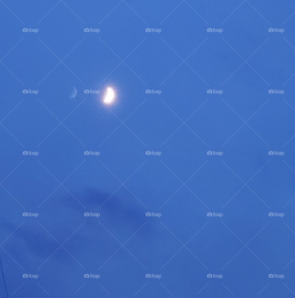 The moon in blue sky,