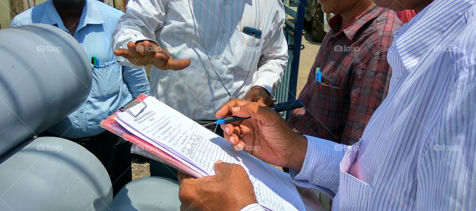 people's working in hands they're doing measurements