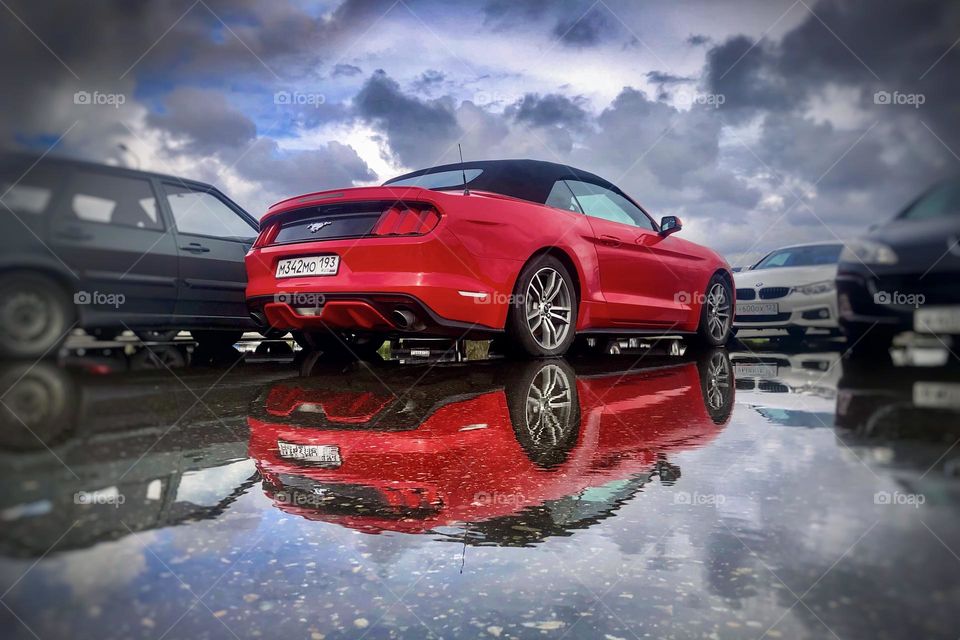 Red sport car with reflection