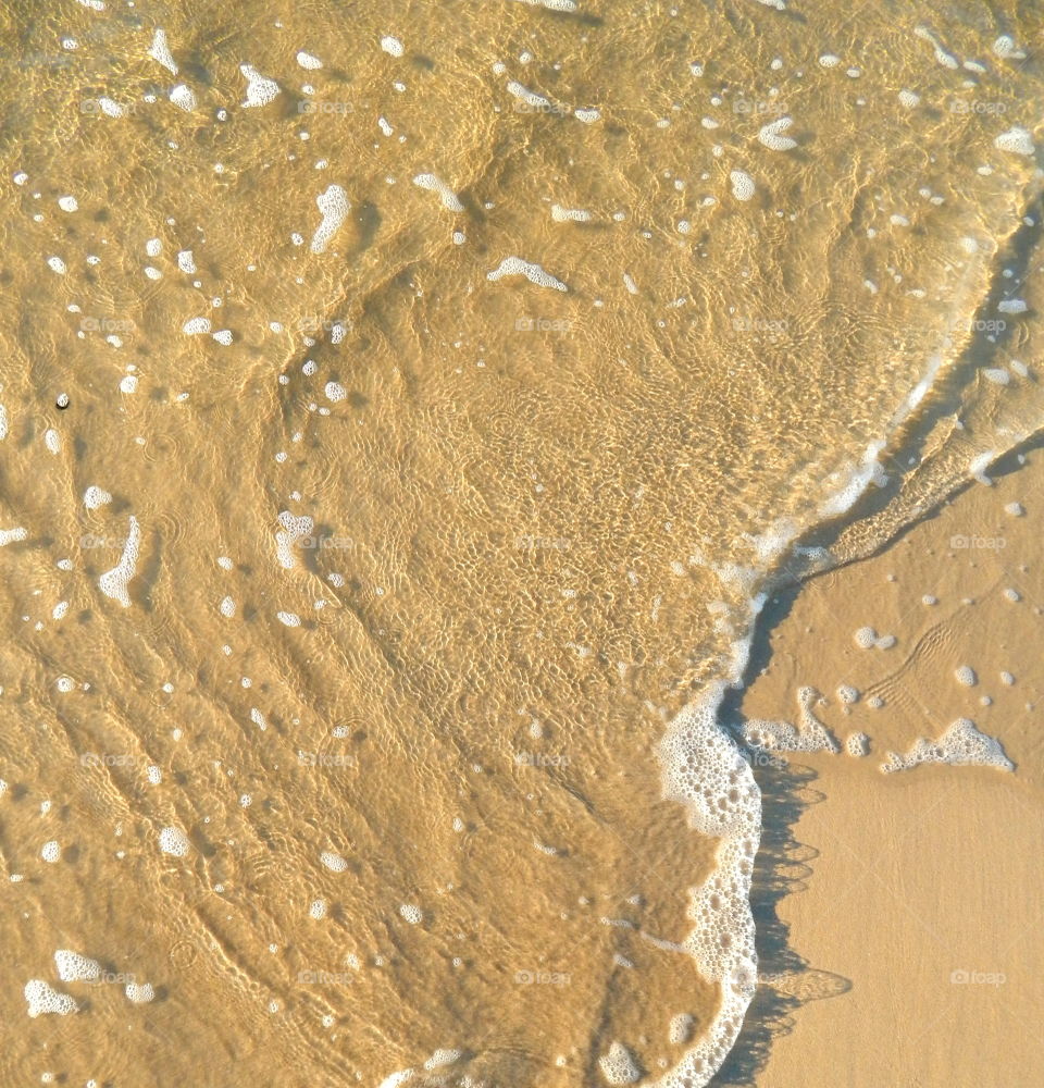 Clear water on sand
