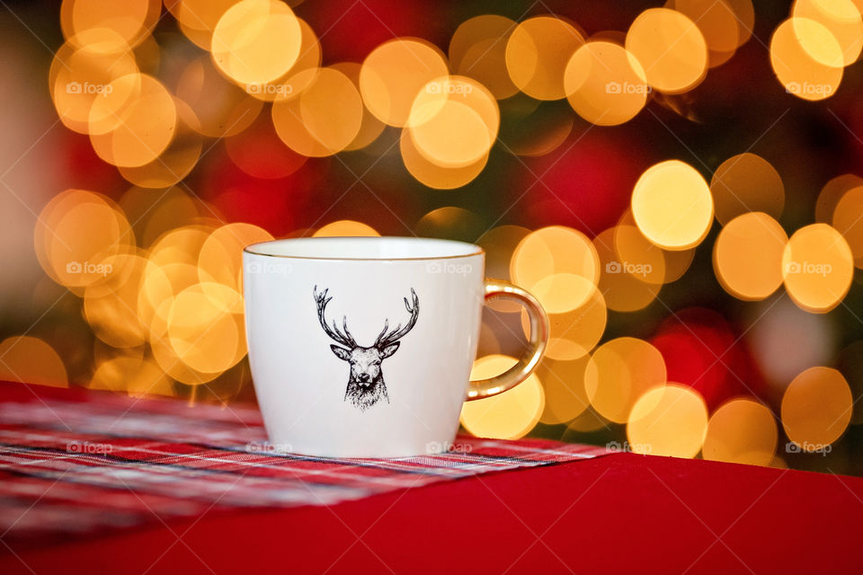 cup of coffee in a cozy festive Christmas atmosphere