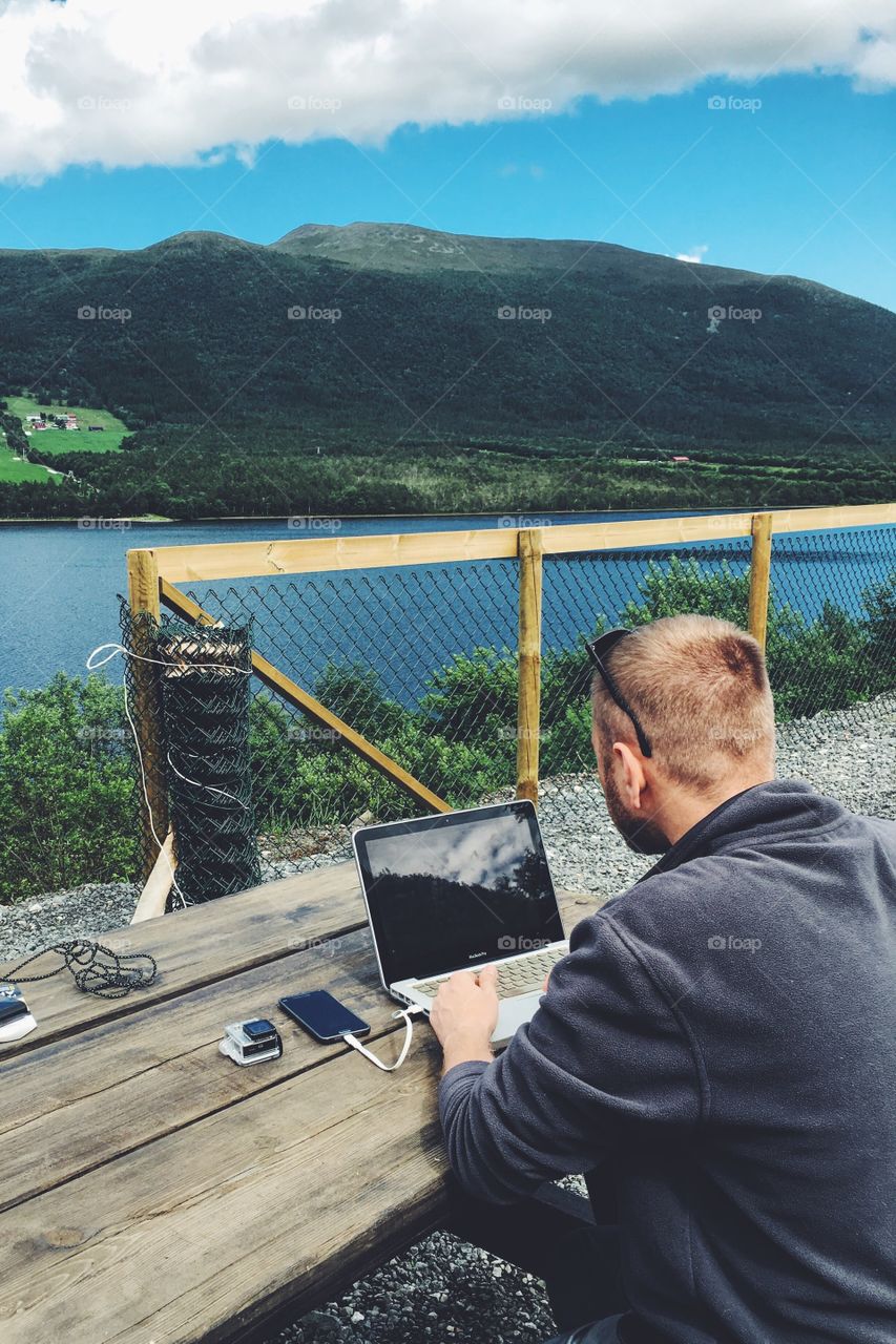 Working outside in the mountains with favorite laptop. 