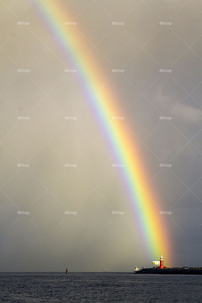 beautiful rainbow over the red lighthouse - Fremantle,Western Australia