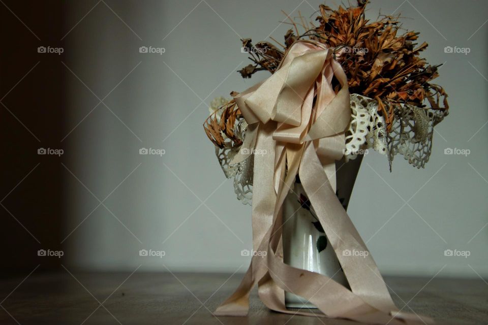 Close up of flowers in a vase in living room