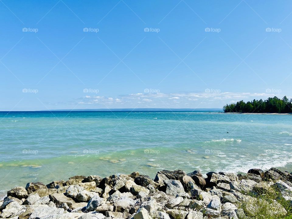 Beautiful blue waters and rocky Shore of Lake Michigan in Northern Michigan near Charlevoix