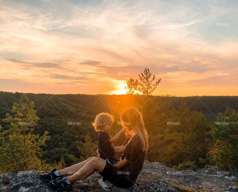 Mom and son on sunset