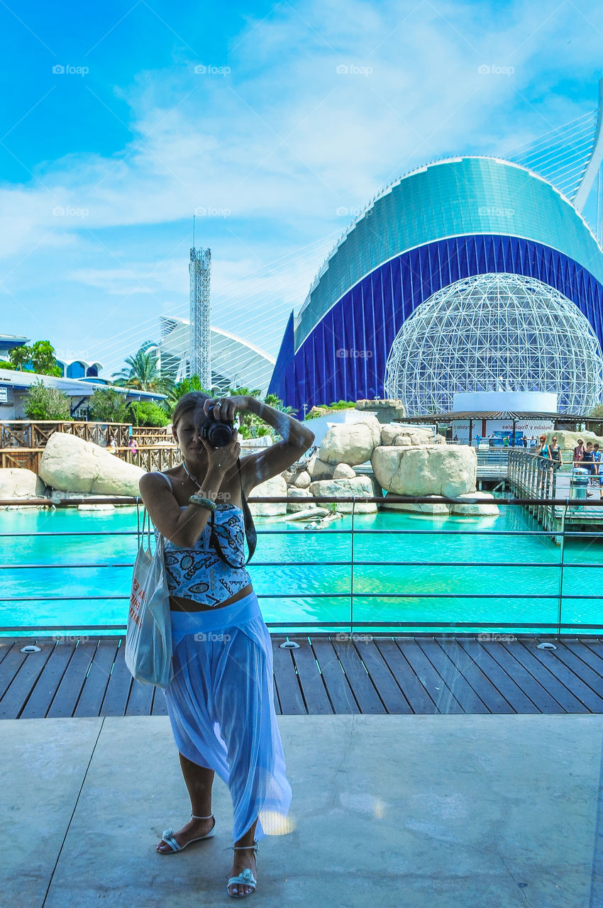 Oceanographic museum in Valencia, yang girl taking proto of her self, reflection in the mirror 