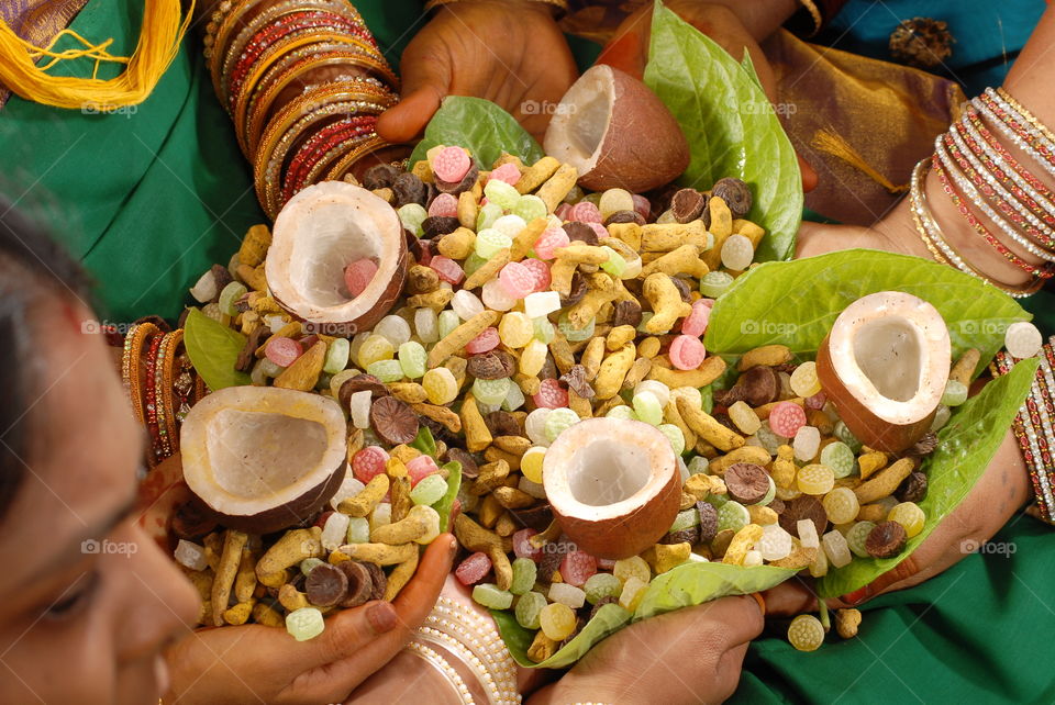 a ladys hand with coconuts