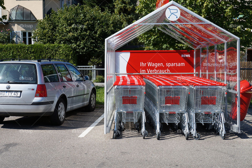 red sunny shopping supermarket by lexlebeur