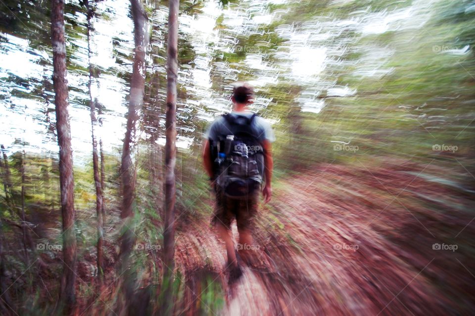 man walking in the forest