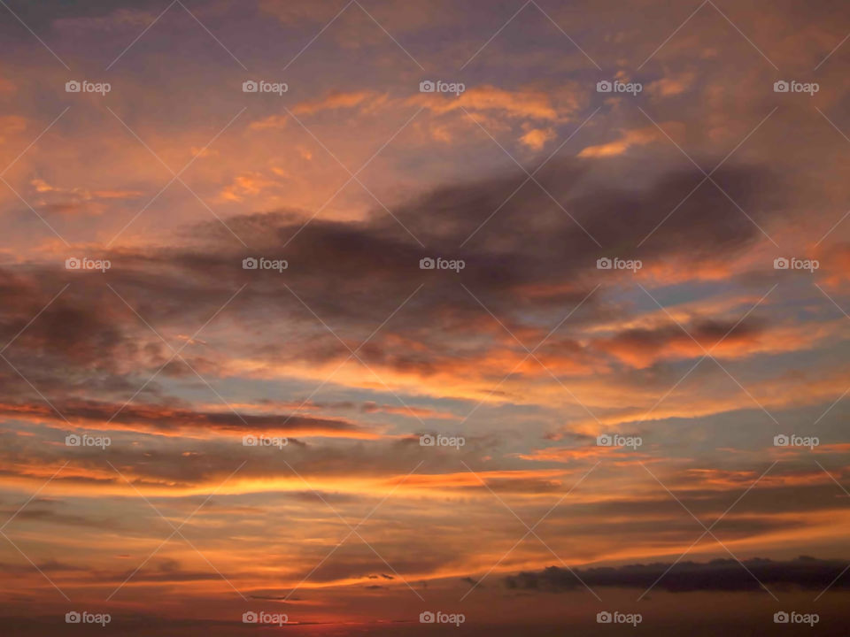 Sky and Clouds Orange Glow. Sky with clouds just before sunset with warm orange glow