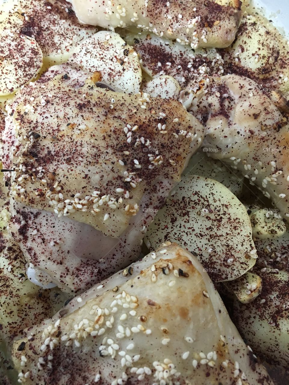 Chicken with potatoes in date sauce, lemon and peppers