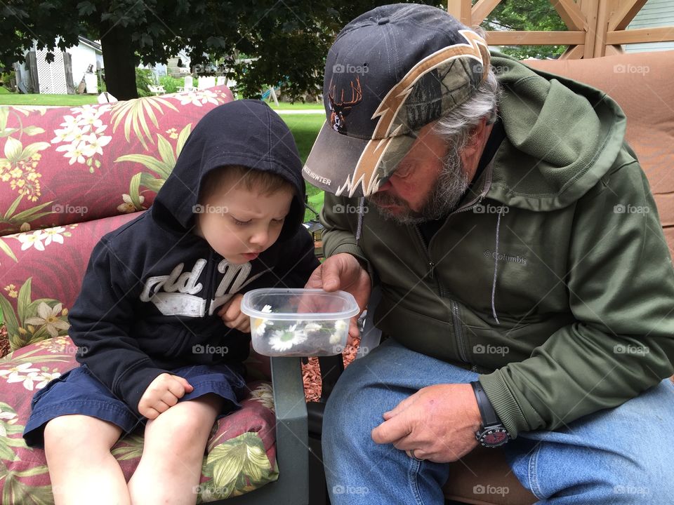 Bug inspecting . Mason and dad checking on his slugs 
