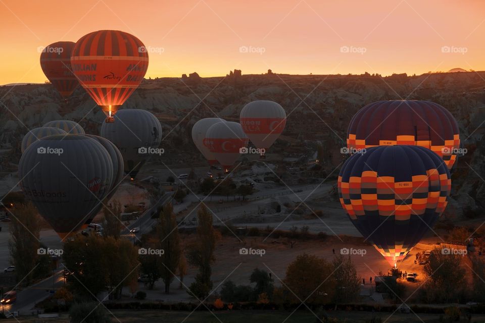 Cappadokia Turkey  flying ballons in the sunset