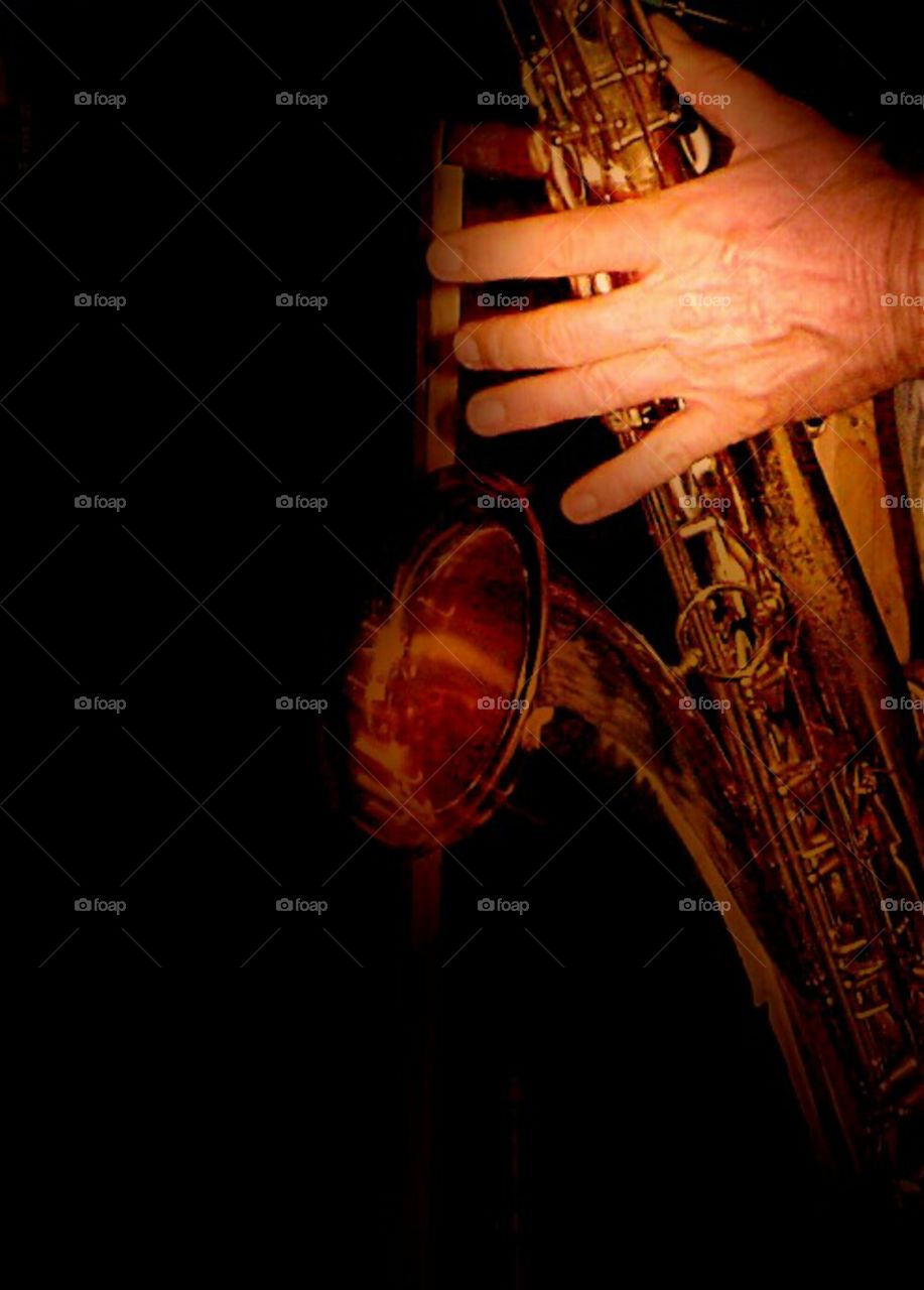 saxophone in hand. Saxophone in hand