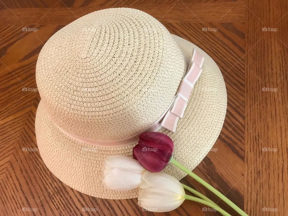 Magenta tulip on a Spring hat.