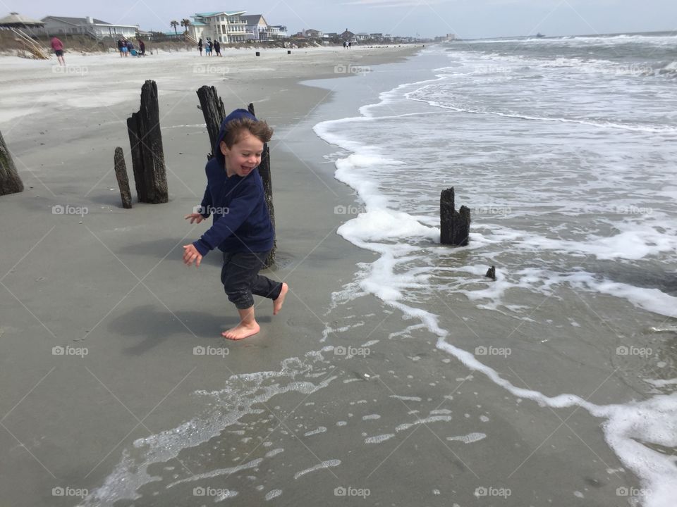 Boy playing on the beach