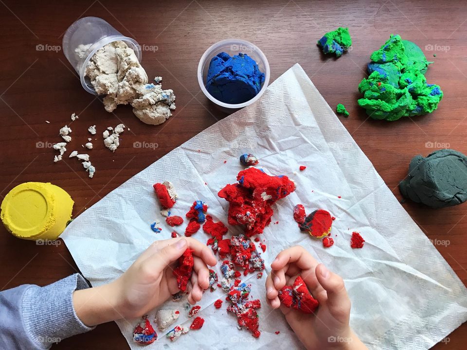 Child playing with clay