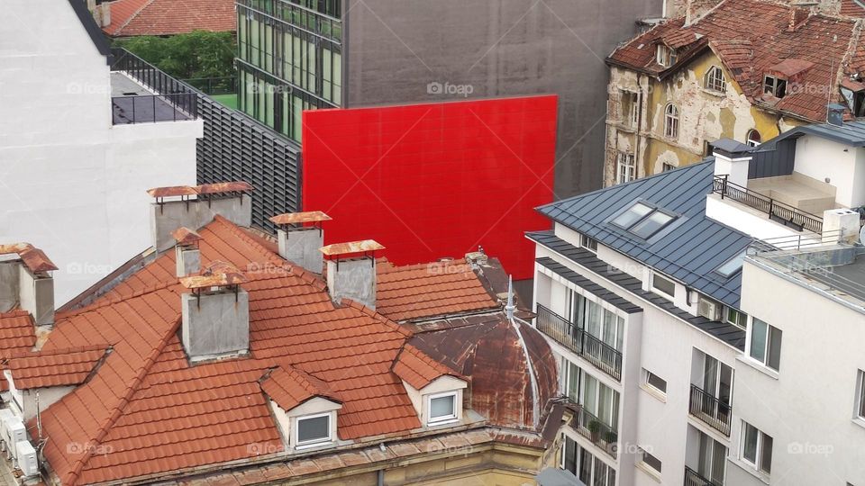 The red wall and roofs