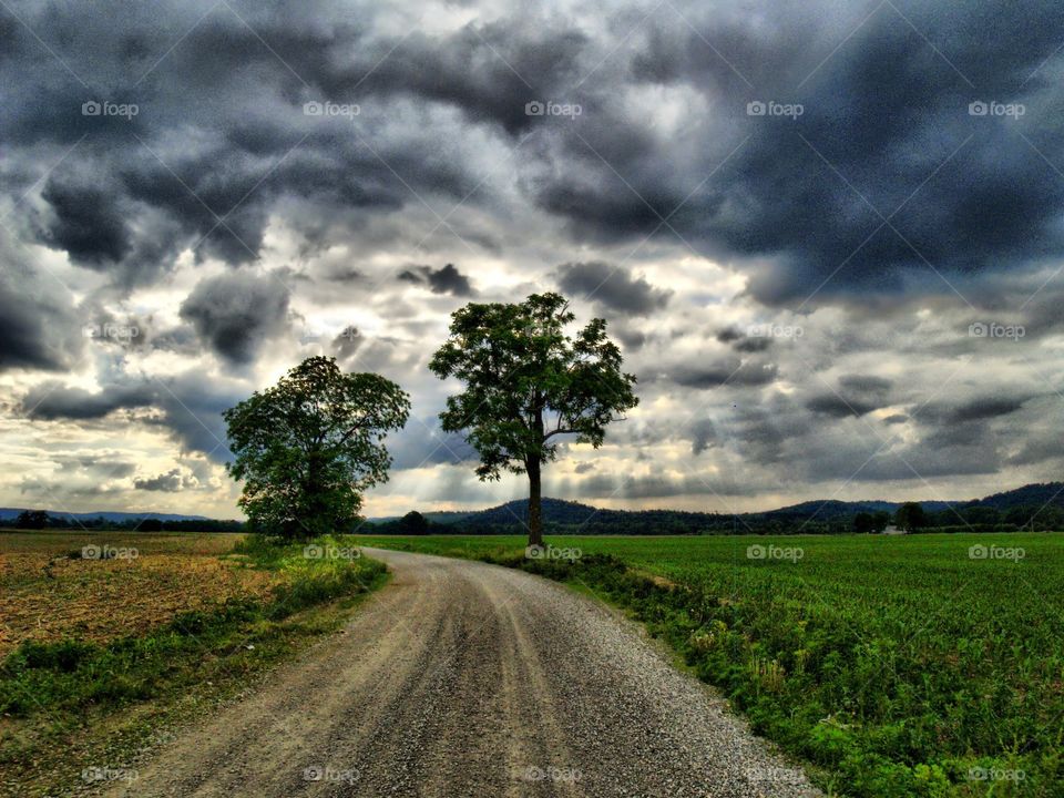 HDR dirt road with stormy sky