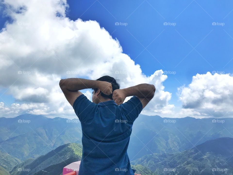 A man relaxing on the mountains