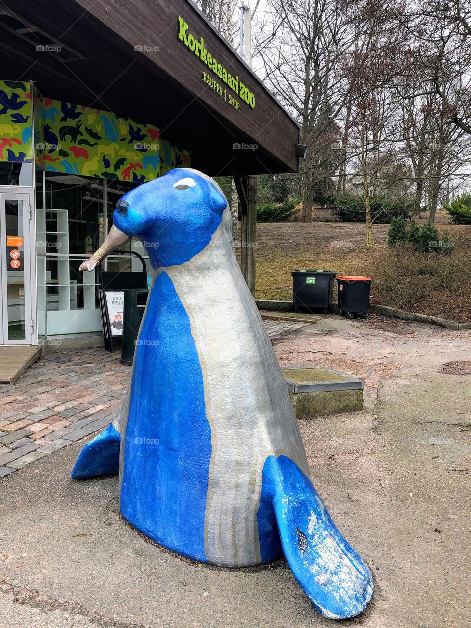 Blue and silver HejHylje! Sea seal figure statue with the fish in his mouth as the part of environmental action for Baltic Sea saving