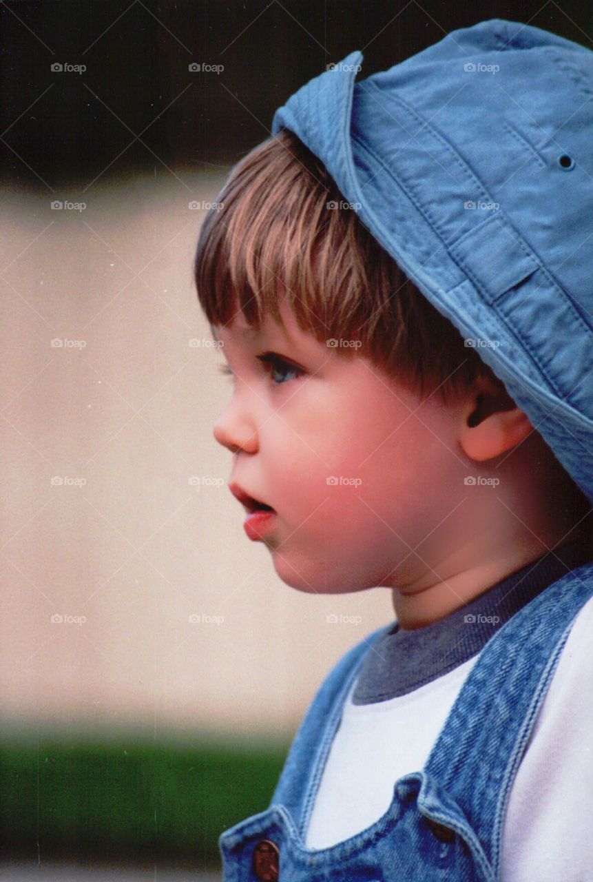 Cute little boy in blue hat