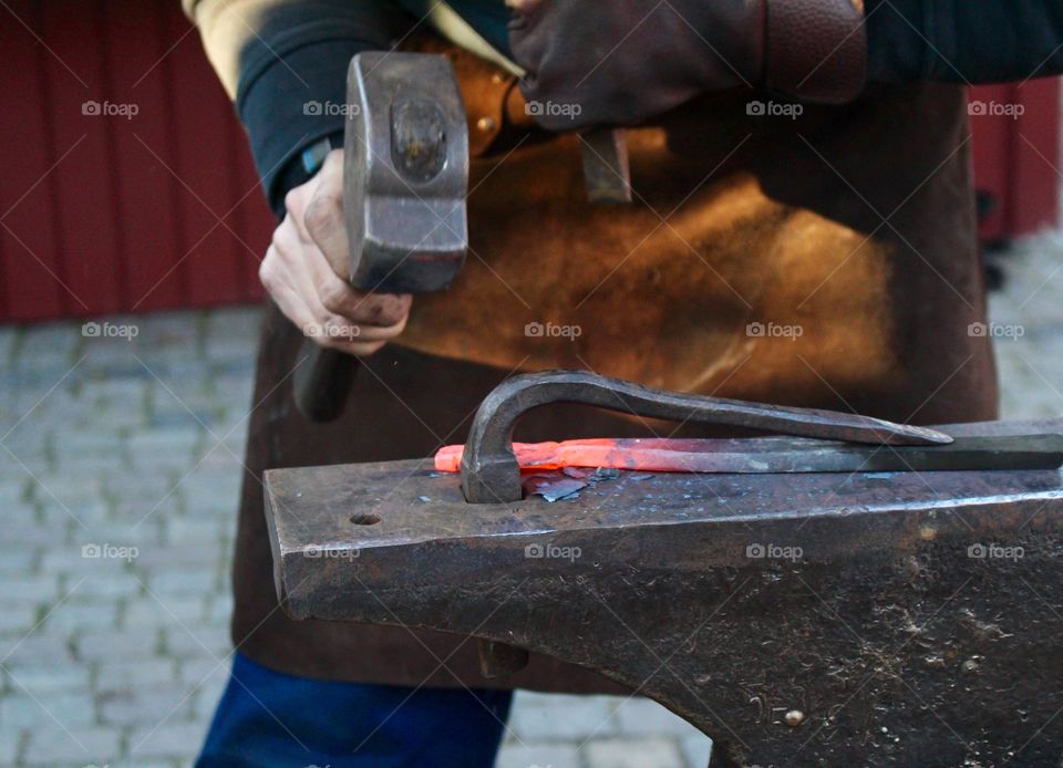 Hammering blacksmith.