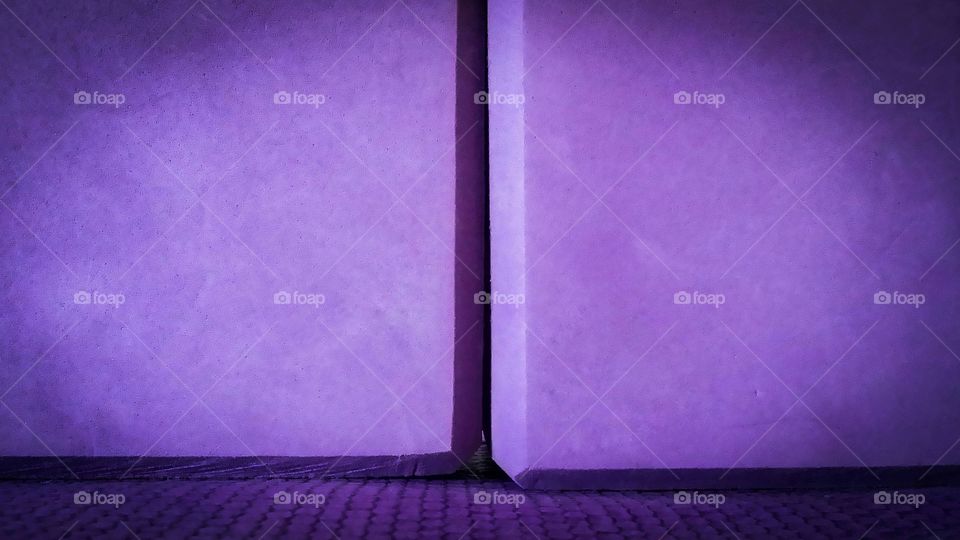 Up close of purple yoga blocks and mat clash of color