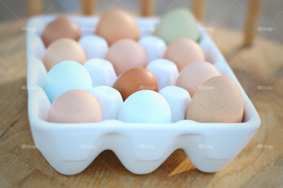 Eggs in carton on table