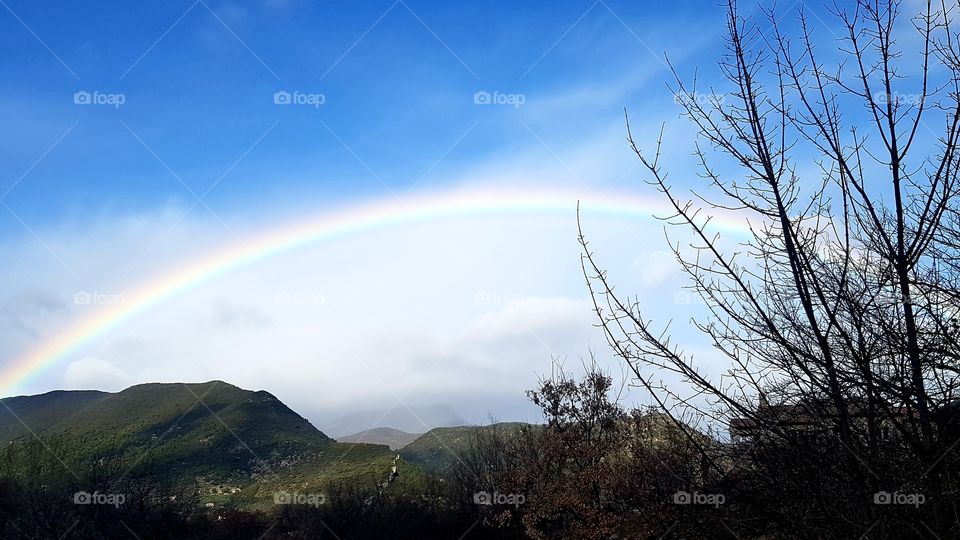 Beautiful rainbow from in the mountains in the area of Nyons, France