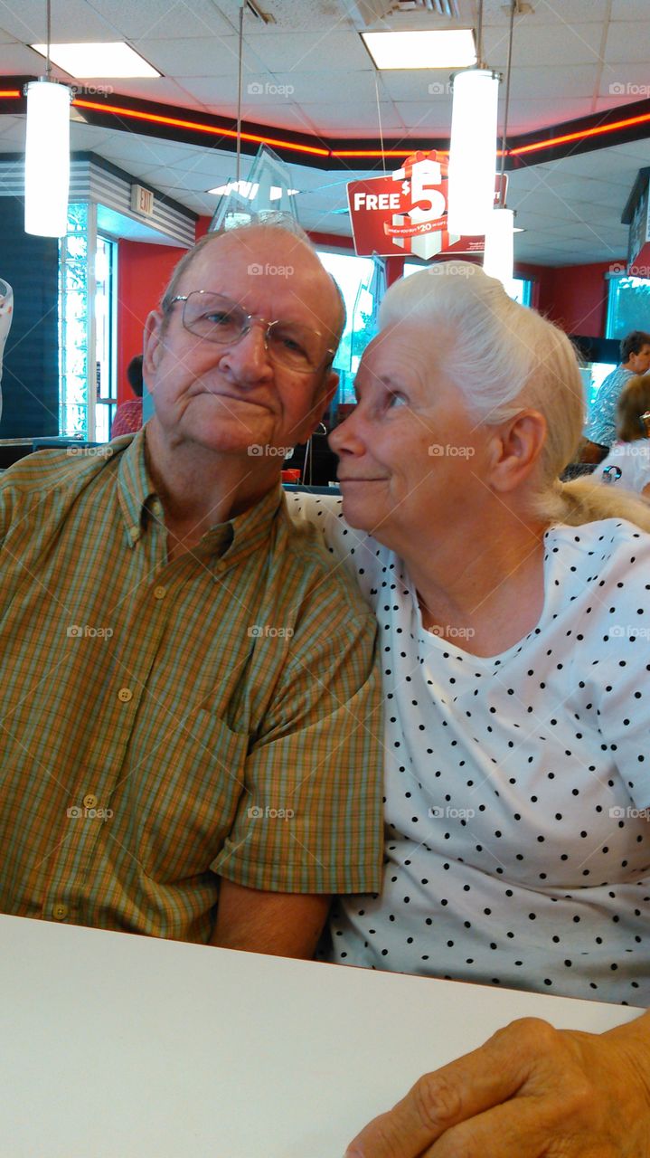 Ageless Love. And older couple in a restaurant