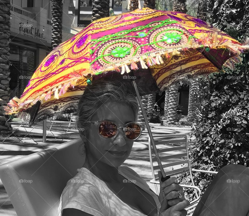 Lady with painted sun umbrella.