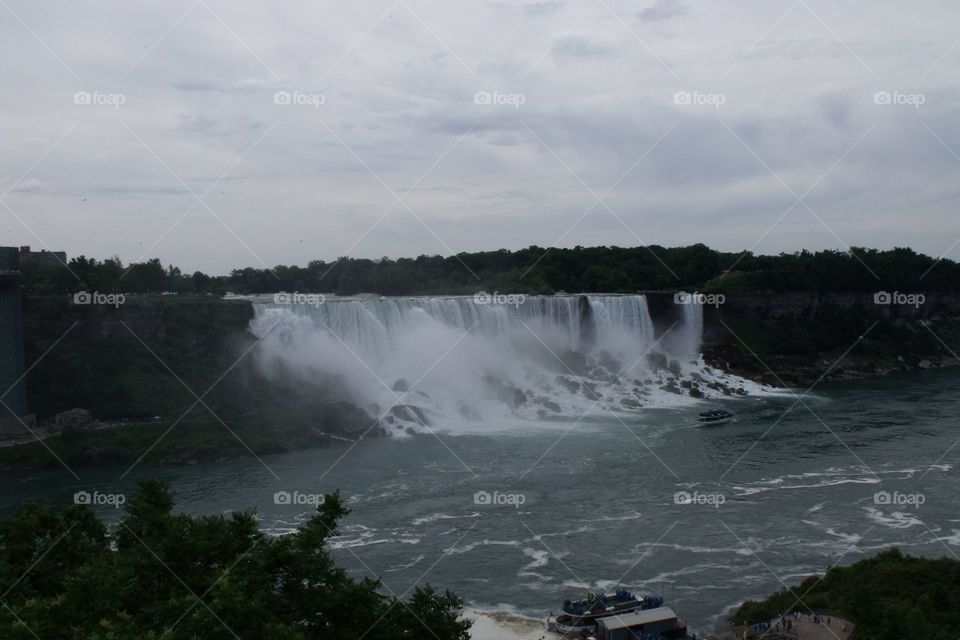 View of American Niagara Falls from Canada.  Bridal Veil Falls at right.