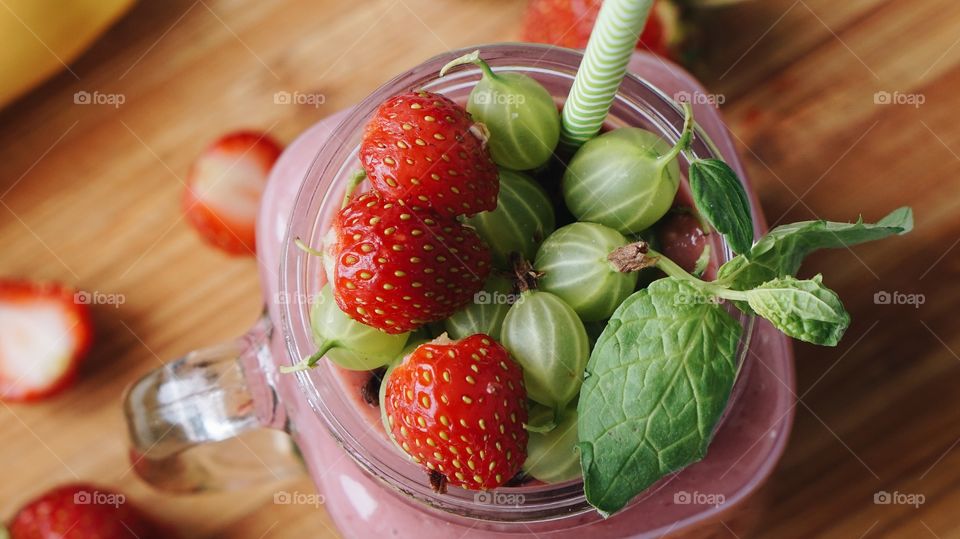 Close-up of strawberry smoothie in jar