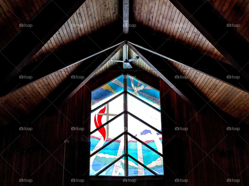 large stained glass window in a church