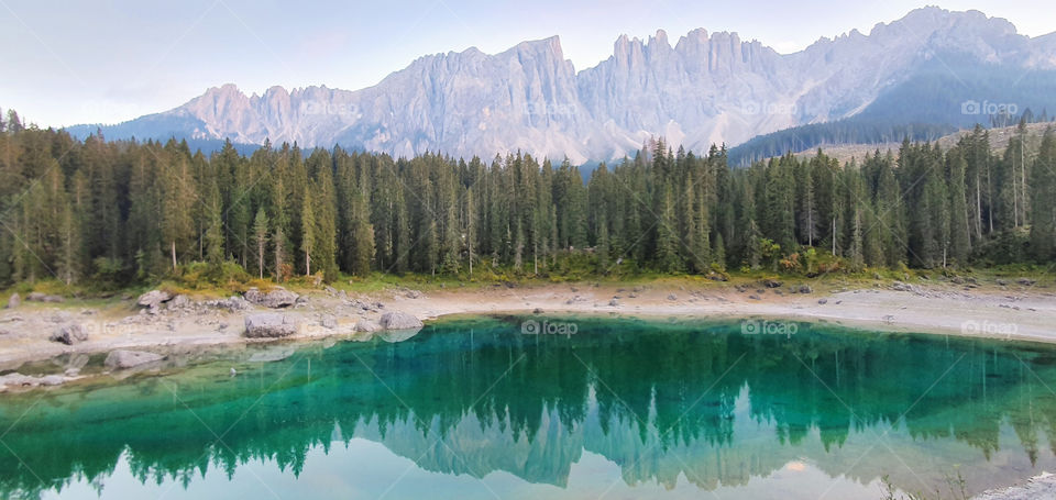 Lago di Carezza reflecting the Dolomites mountains