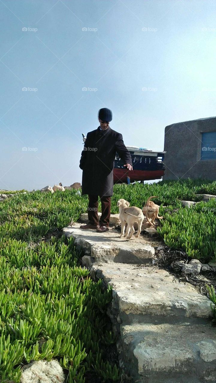 People walking with dog.