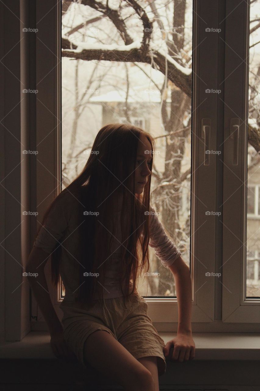 Girl near the window