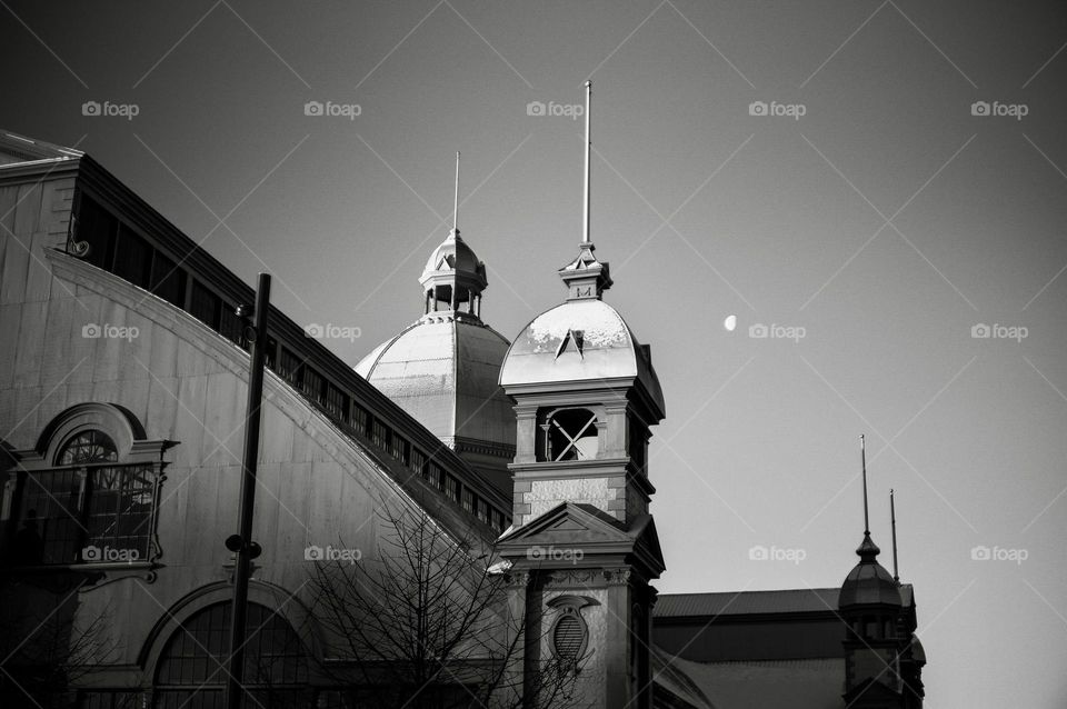 The Northeast tower on the Aberdeen Pavilion with a three quarter moon in the background.