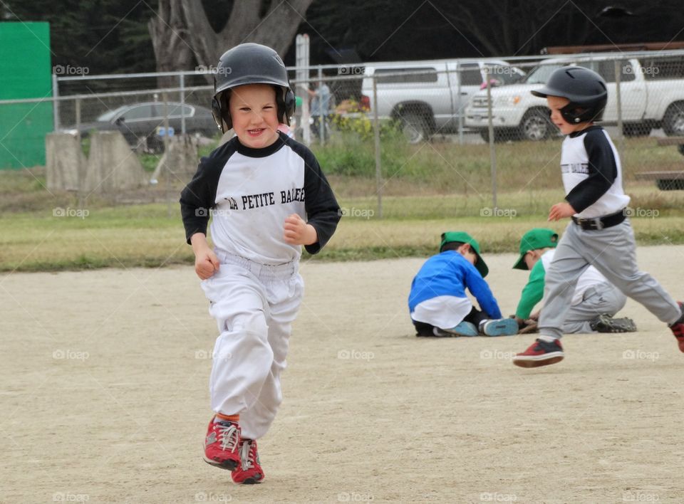 Love Running. Young Baseball Runner
