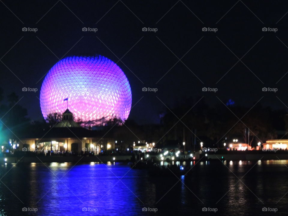 The reflection of Spaceship Earth reaches into the surface of the World Showcase lagoon at EPCOT at the Walt Disney World Resort in Orlando, Florida.