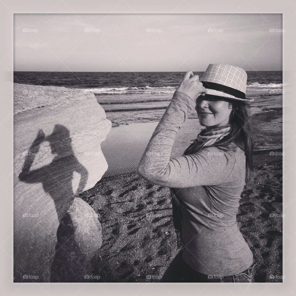 Girl posing by the sea
