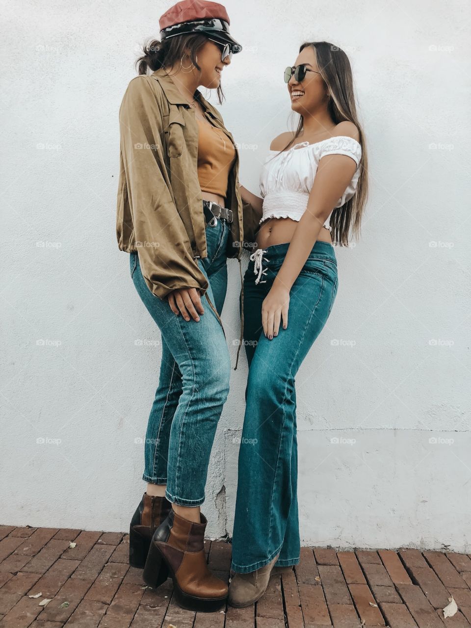 Young friends enjoying the day in their cute vintage outfits and Bell bottom jeans.