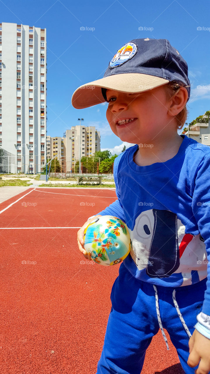 Playful kid with ball