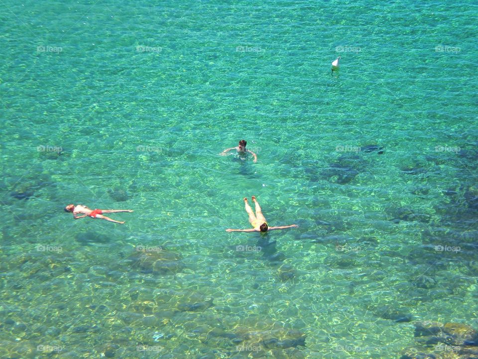 Swimming in the sea of Palinuro ( Italy ).