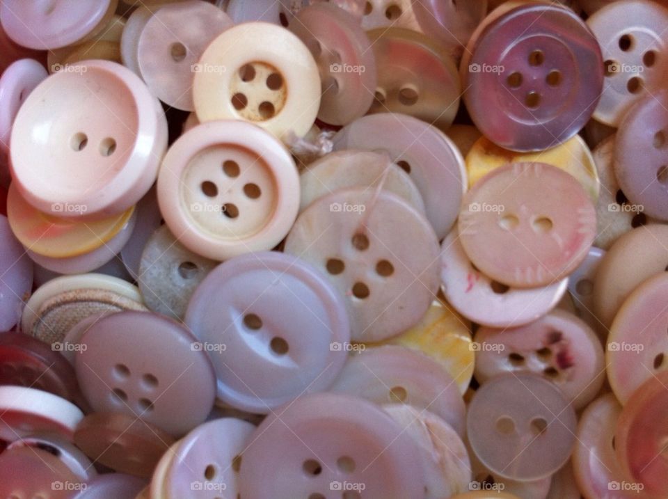 Lot of buttons in light colors.