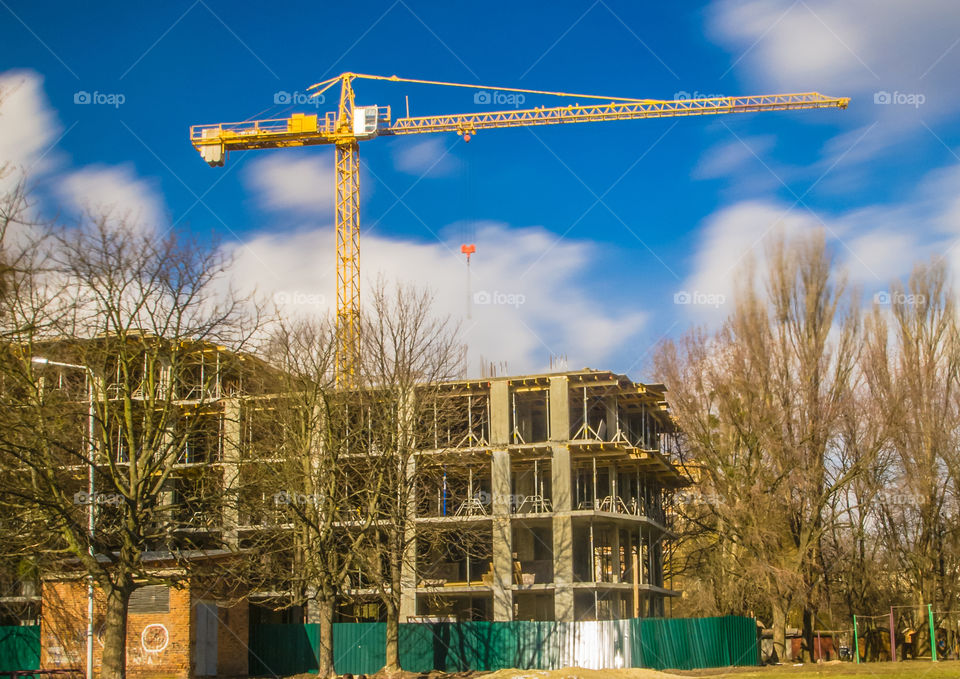 building process with crane on long exposure