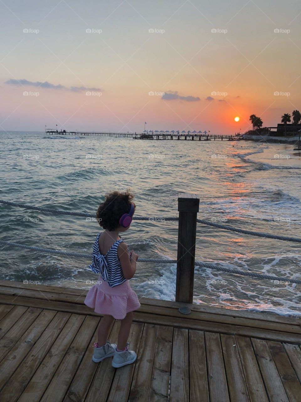 A summer sunset, a little girl, a music