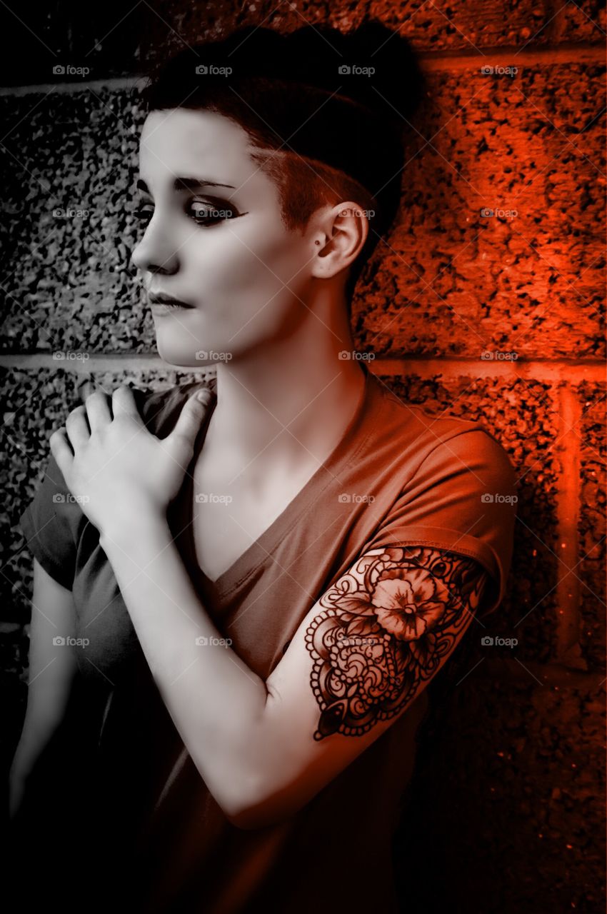 Beautiful woman showing her tattoo